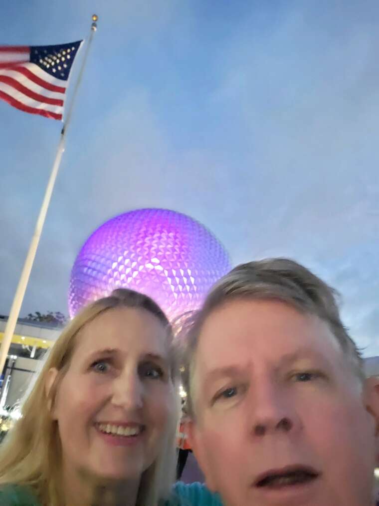 peak dad selfie in front of the epcot dome